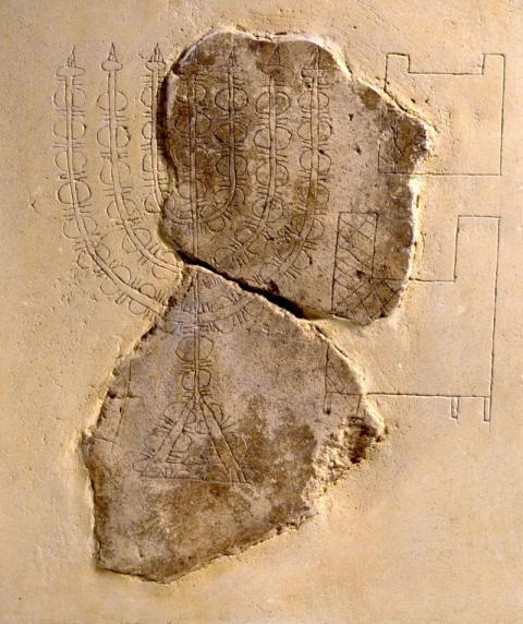 Depiction of Menorah and Showbread table incised on wall